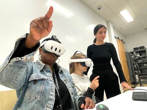 At OROT’s offices in the JGH, Nursing Educators Chedly Augustin (left) and Julie Verville (centre) wear VR headsets for a training session on immersive technology. They’re assisted by Johana Dahan (standing), a Planning, Programming and Research Officer in the Directorate of Learning Partnerships and Knowledge Activation.