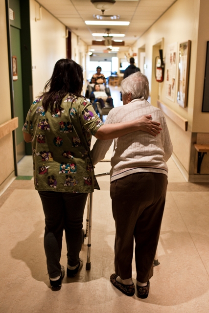 A beneficiary attendant walking with a resident in a long-term care facility of CIUSSS West-Central Montreal A beneficiary attendant walking with a resident in a long-term care facility of CIUSSS West-Central Montreal